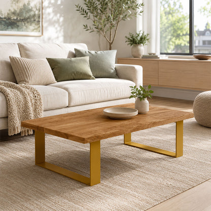 Minimalist living room featuring a wooden coffee table with gold metal Good Point Coffee Table Legs (Two Legs) on a neutral rug, complementing soft beige sofa and green throw pillows.