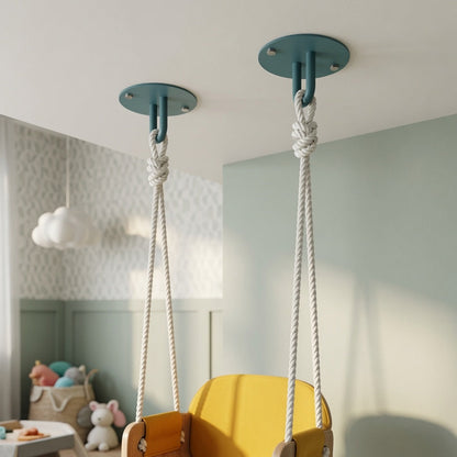 Two teal Hang On Ceiling Hooks securely fasten ropes for a wooden swing in a softly lit, minimalist kids' room with organized decor.