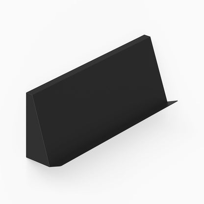 Black minimalist metal wall shelf with angled ledge designed for display and organization, called Issue Book + Magazine Wall Display.