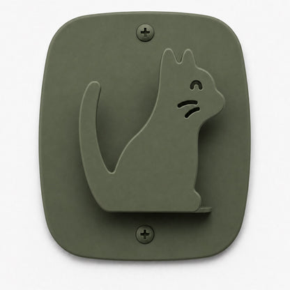 Minimalist olive-green wall hook in a playful cat shape made from durable material, part of the Kiddo Hooks collection for organizing and displaying items.