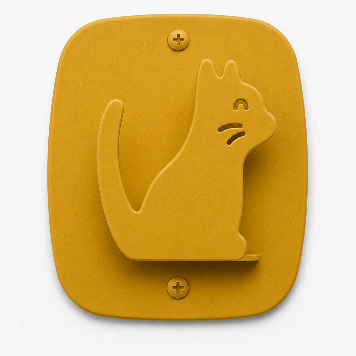 Kiddo Hooks wall hook in honey mustard color shaped like a cat, combining playful design with functional wall organization.