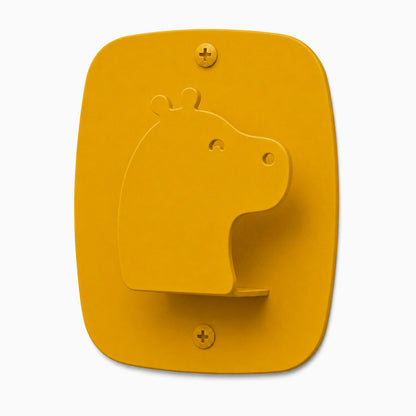 Kiddo Hooks wall hook in a honey mustard color shaped like a hippo, made from durable mixed materials for organizing kids’ spaces.