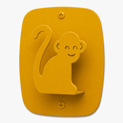 Kiddo Hooks wall hook in honey mustard color shaped like a smiling monkey, designed for functional and playful organization.