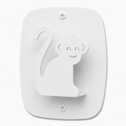 White minimalist wall hook shaped like a smiling monkey, made from durable rust-resistant material, designed as Kiddo Hooks for organizing spaces.