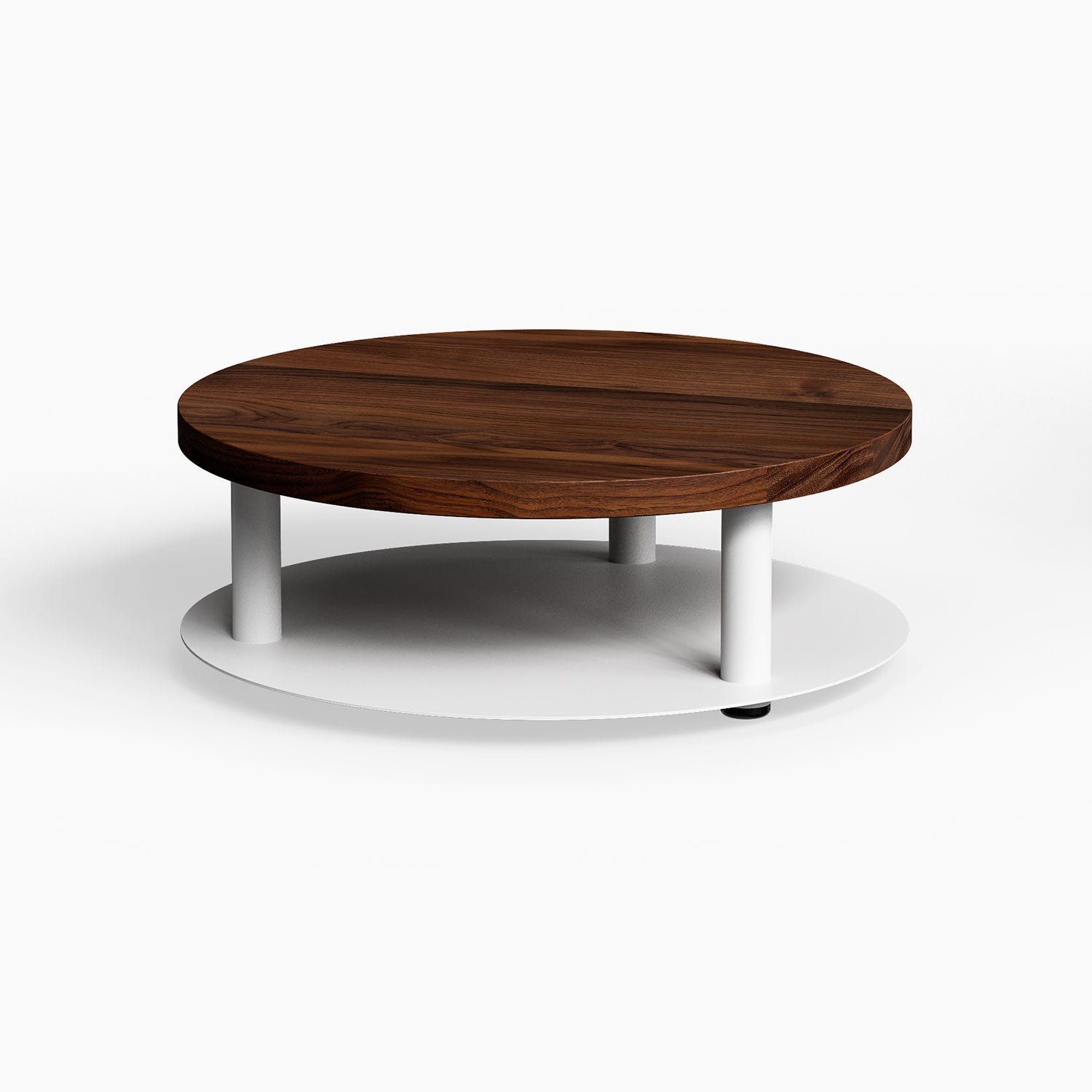 Ledger Coffee Table featuring a minimalist round walnut wood top balanced on a sturdy white metal base for modern living spaces.
