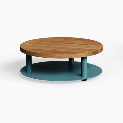 Ledger Coffee Table with a natural wood top and teal steel base, featuring a minimalist, functional design ideal for organizing living spaces.