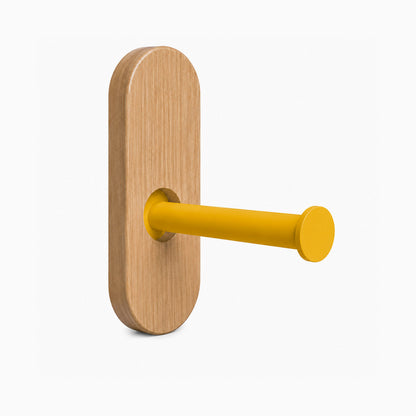 Lou Toilet Paper Holder featuring a minimalist solid hardwood backplate and a honey mustard steel arm, designed for functional wall storage.