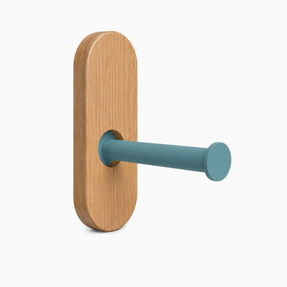 Lou Toilet Paper Holder with natural wood mount and matte blue steel arm, designed for minimalist, functional wall organization.