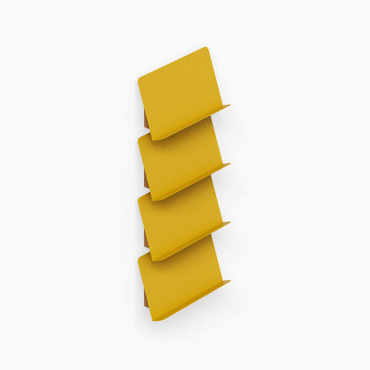 The Edit Book +Magazine Display in yellow metal with four angled shelves designed for functional and stylish organization of books and magazines.