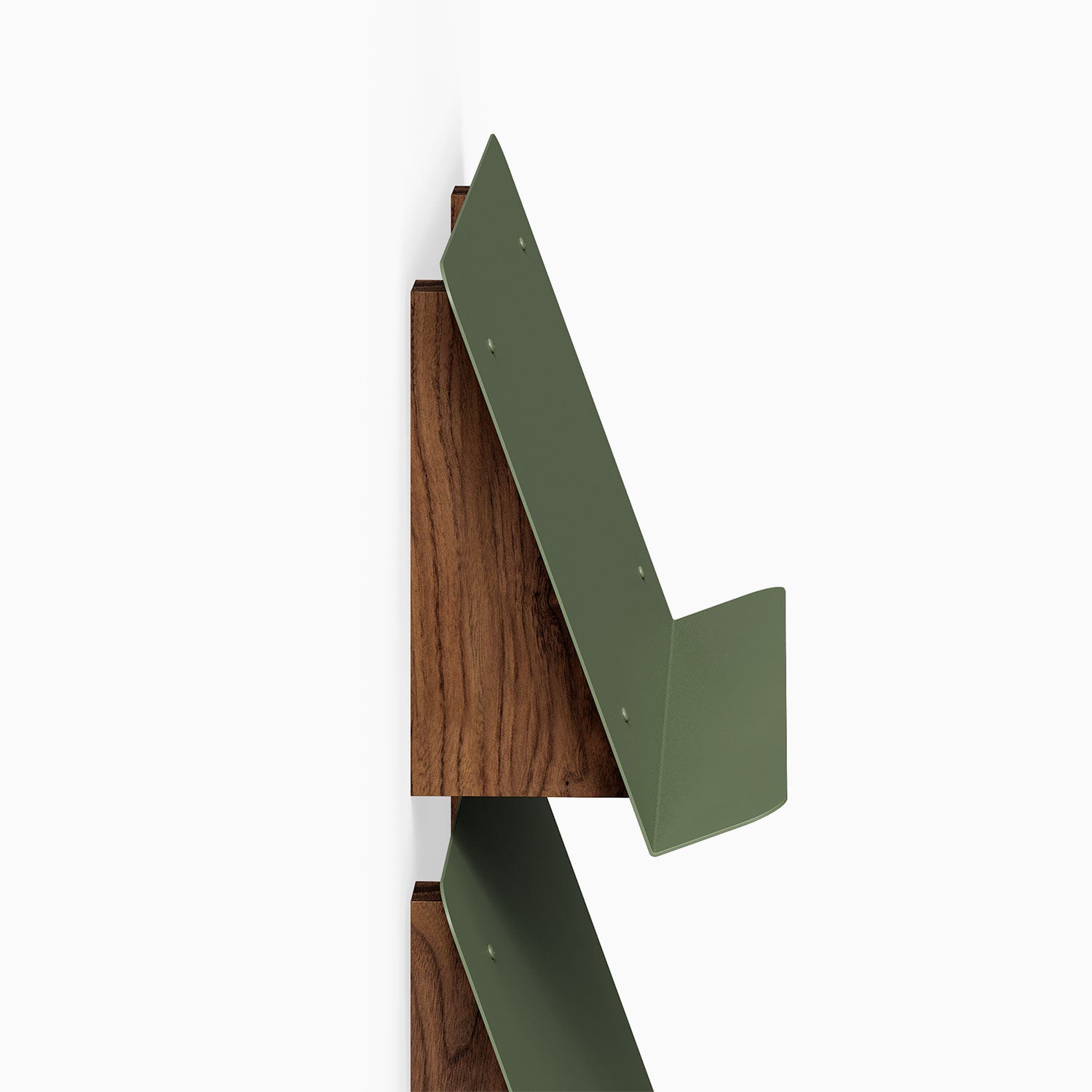 The Edit Book +Magazine Display features a sleek walnut wood back with angled olive green metal supports, designed for minimalist wall organization.