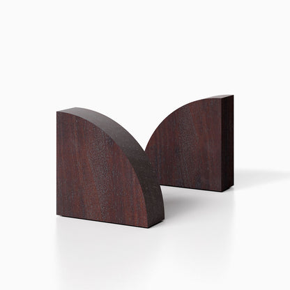 The Maggie Radius Product (dutch mocha finish) pictured against a white background. Two bookends positioned in the center, one slightly off center, in front of the other.