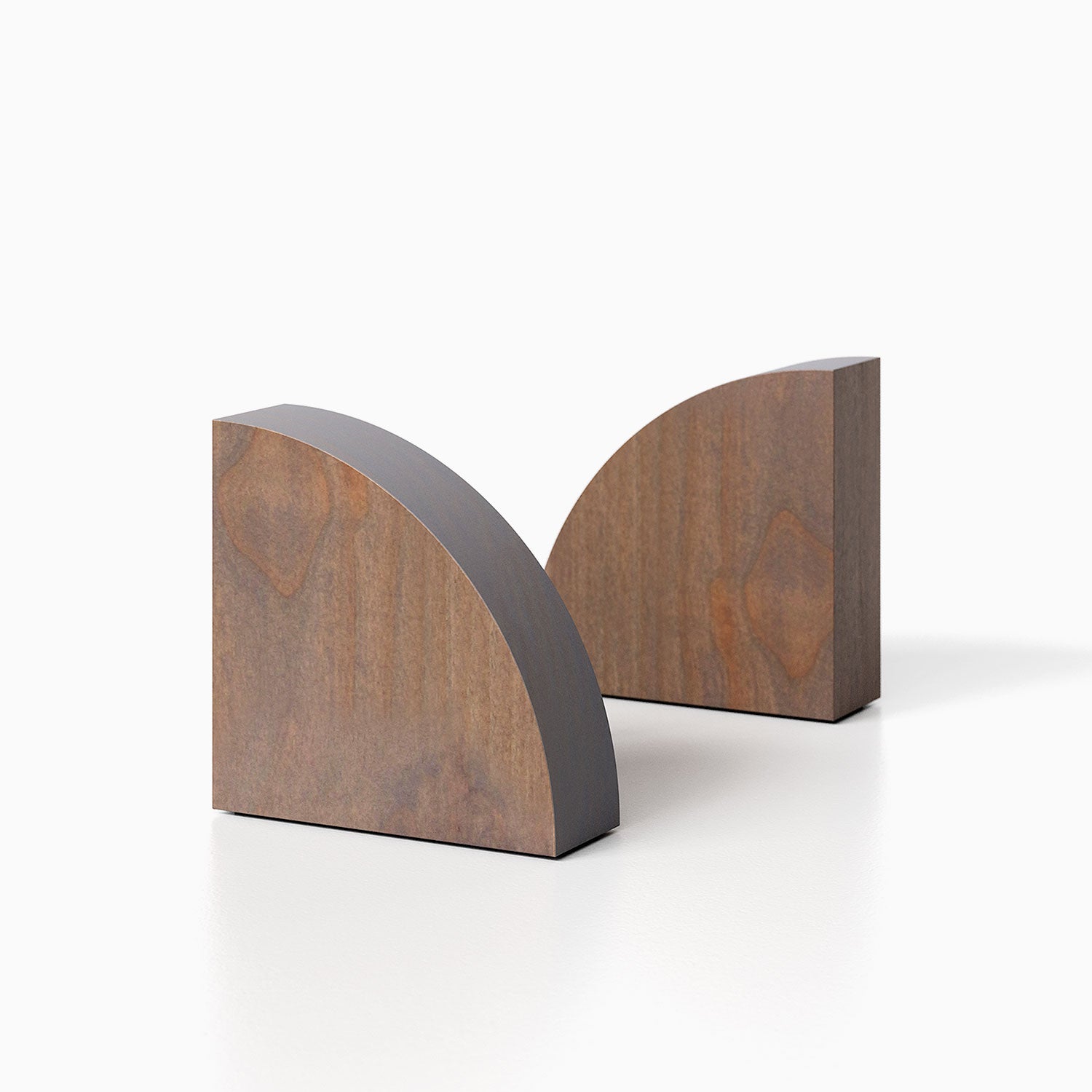 The Maggie Radius Product (hatch grey finish) pictured against a white background. Two bookends positioned in the center, one slightly off center, in front of the other.