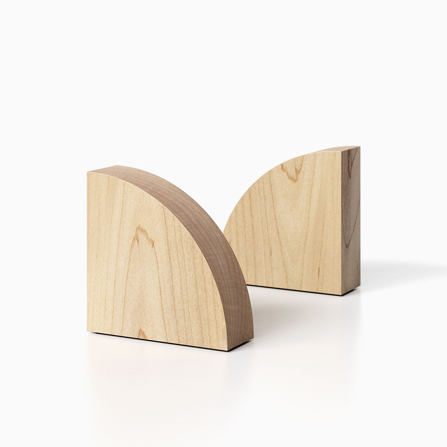 The Maggie Radius Product (Maple finish) pictured against a white background. Two bookends positioned in the center, one slightly off center, in front of the other.