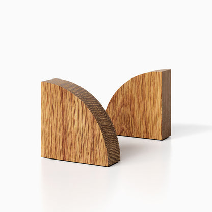 The Maggie Radius Product (White oak finish) pictured against a white background. Two bookends positioned in the center, one slightly off center, in front of the other.
