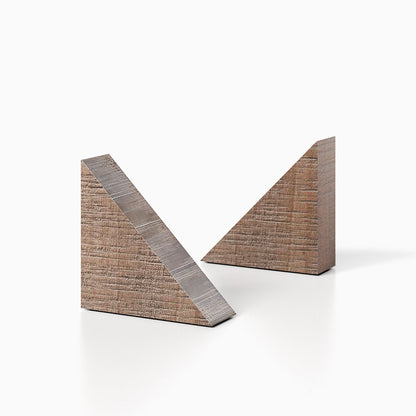 The Maggie triangle Product (hatch grey rustic  finish) pictured against a white background. Two bookends positioned in the center, one slightly off center, in front of the other.