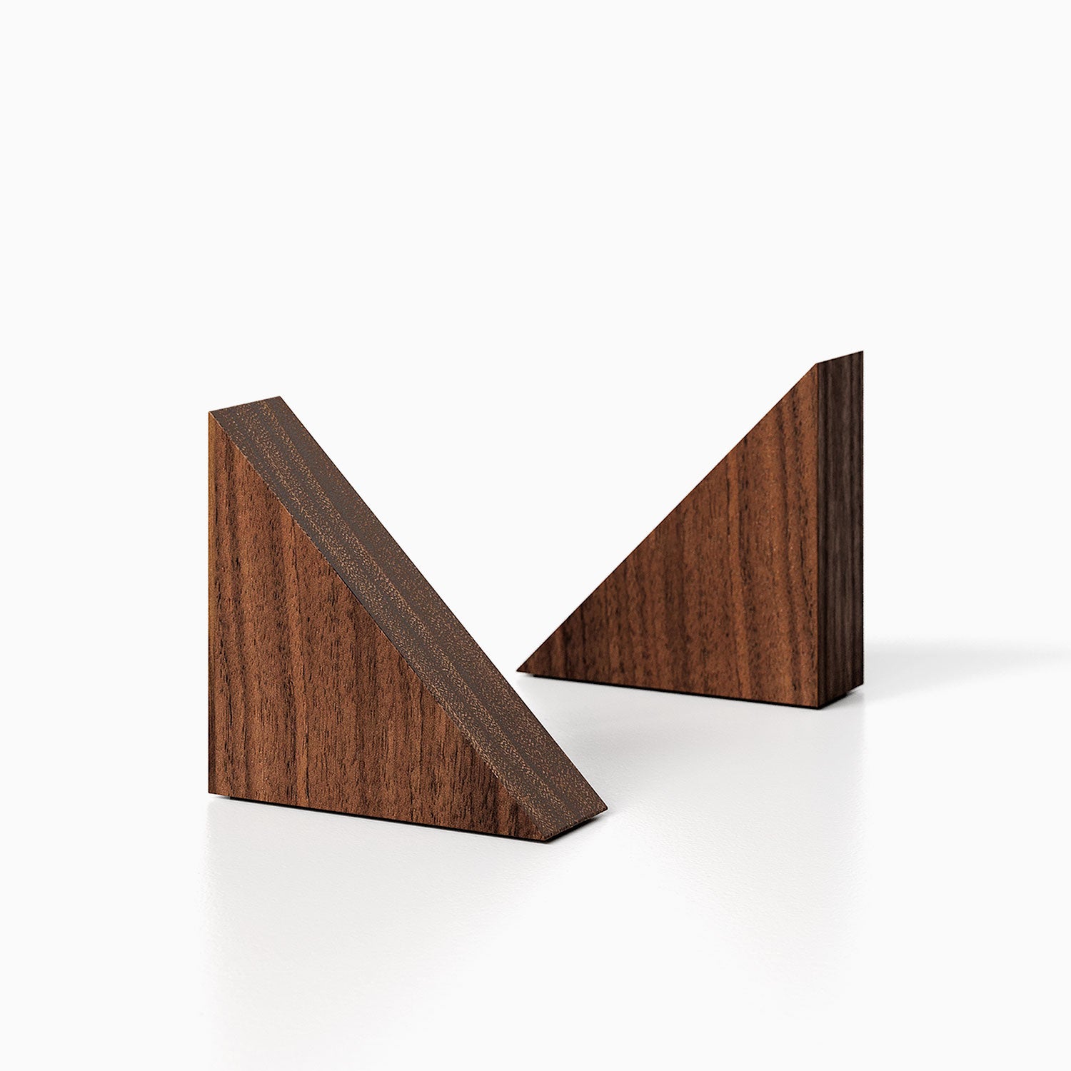 The Maggie triangle Product (walnut finish) pictured against a white background. Two bookends positioned in the center, one slightly off center, in front of the other.