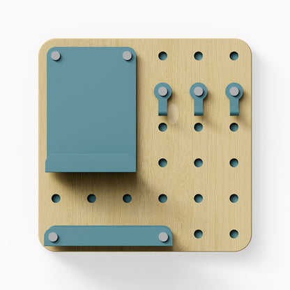Morgan Busy Bee Pegboard Set with light wood and muted teal metal components including hooks, a small shelf, and a vertical holder for wall organization and display.