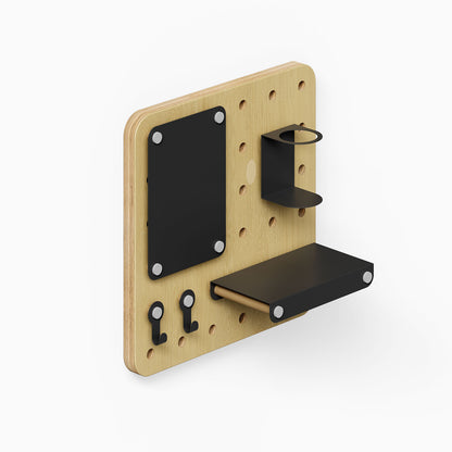 Morgan Put it There Pegboard Set with natural wood pegboard and black metal floating shelf, hooks, and small container for organized wall display.