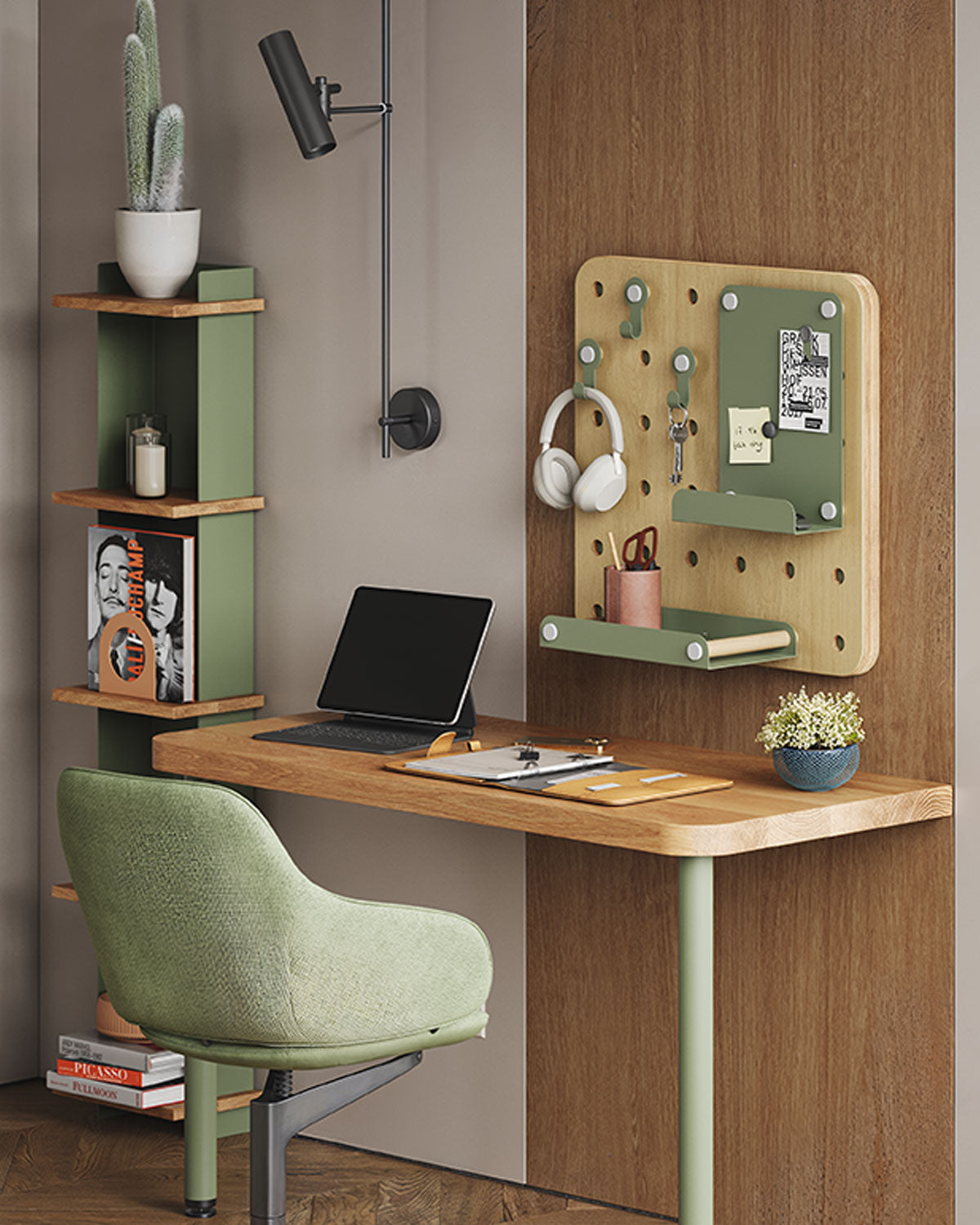 Compact home office with a wood desk, green chair, wall shelves, pegboard organizer, task lamp, laptop, books, and plants