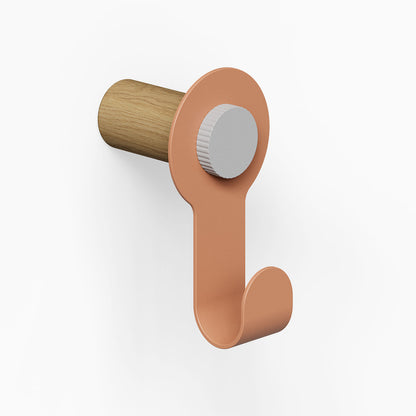 Morgan Pegboard Hook with a minimalist design featuring a clay-colored metal hook and a solid hardwood peg for durable wall organization.