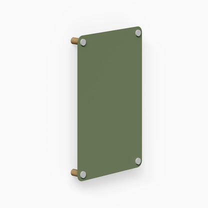 Morgan Magnet Board in muted green with rounded corners, featuring a minimalist design with wooden mounting pegs and steel magnets for wall organization.
