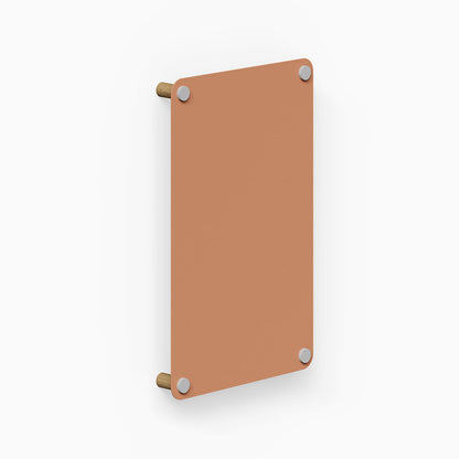 Morgan Magnet Board in clay color mounted on a wall with wooden supports, showcasing minimalist design and durable materials.