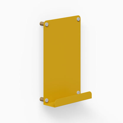Morgan Magnet Ledge Board in honey mustard with stainless steel accents, a minimalist wall display ledge for organizing and showcasing items.