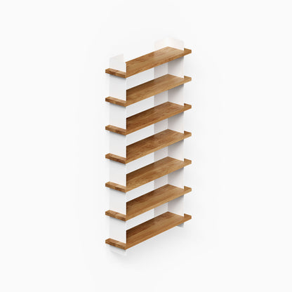 Nigel Bookshelf featuring six wood shelves supported by white steel brackets, combining solid hardwood and metal floating shelves for organized wall display.