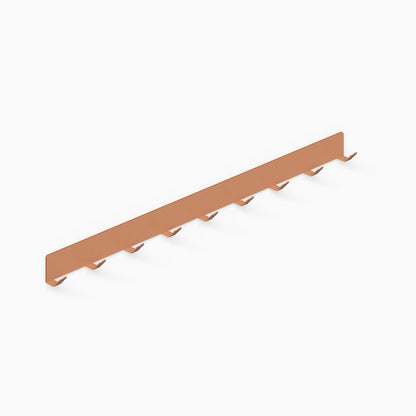 Of Course Wall Hook in matte clay finish with nine hooks, designed for minimalist organization and functional wall display in various rooms.