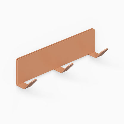 Of Course Wall Hook in rust-resistant steel with minimalist clay-colored finish, designed for functional and stylish wall organization.