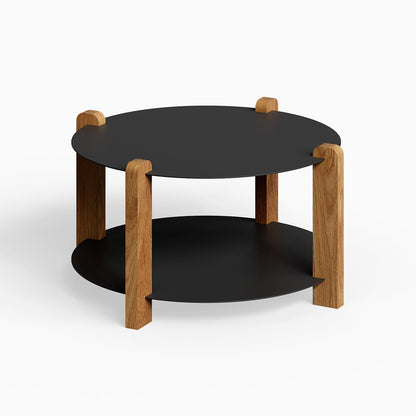 Otis Round Coffee Table with black metal shelves and solid white oak legs, minimalist design ideal for functional living spaces.