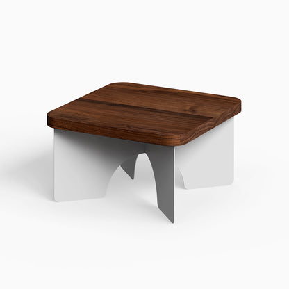 Ledger Coffee Table with a solid hardwood walnut top and white minimalist steel legs, blending function and modern design.
