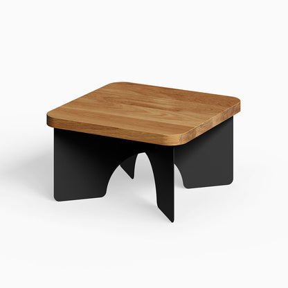 Ledger Coffee Table featuring a solid hardwood top with smooth edges and sturdy black metal legs in a minimalist, modern design.