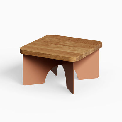 Ledger Coffee Table with a solid hardwood top and minimalist rust-colored steel legs, blending mixed materials for functional modern decor.