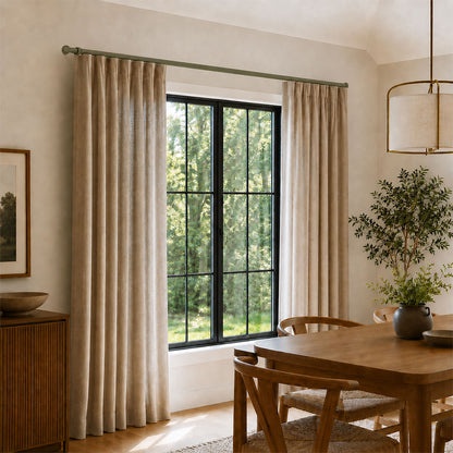 Ringo Curtain Rod Kit installed with beige curtains framing a large window in a minimalist dining room featuring wood furniture, soft natural light.