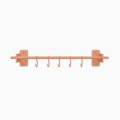 Rue Utensil Rack in matte clay color with six hooks designed for maximizing wall space and organizing kitchen tools efficiently.