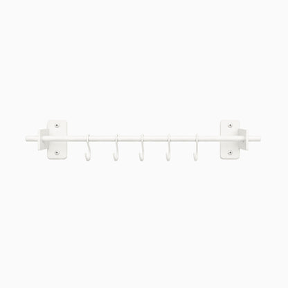 Rue Utensil Rack in white metal with six hooks, designed for minimalist wall organization and durable, functional kitchen storage.