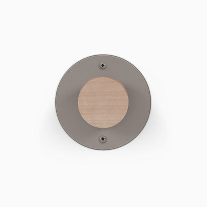 Runda Coat Rack 1 round gray metal wall hook with a solid wood center and two visible mounting screws