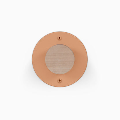Runda Coat Rack 1 round wall mounted coat hook with a warm copper finish and natural wood center