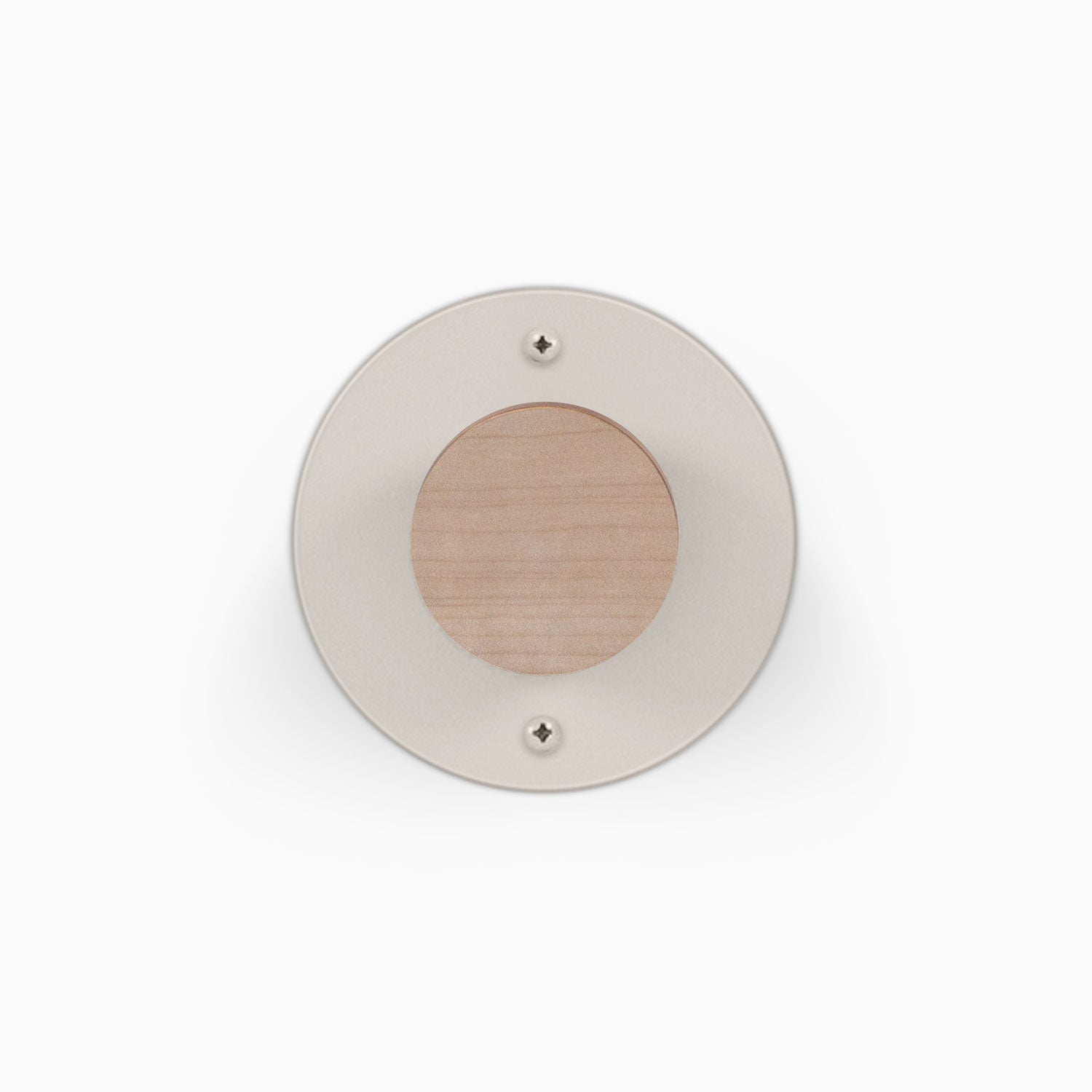Runda Coat Rack 1 round wall mounted coat rack with a light wood center and neutral circular faceplate