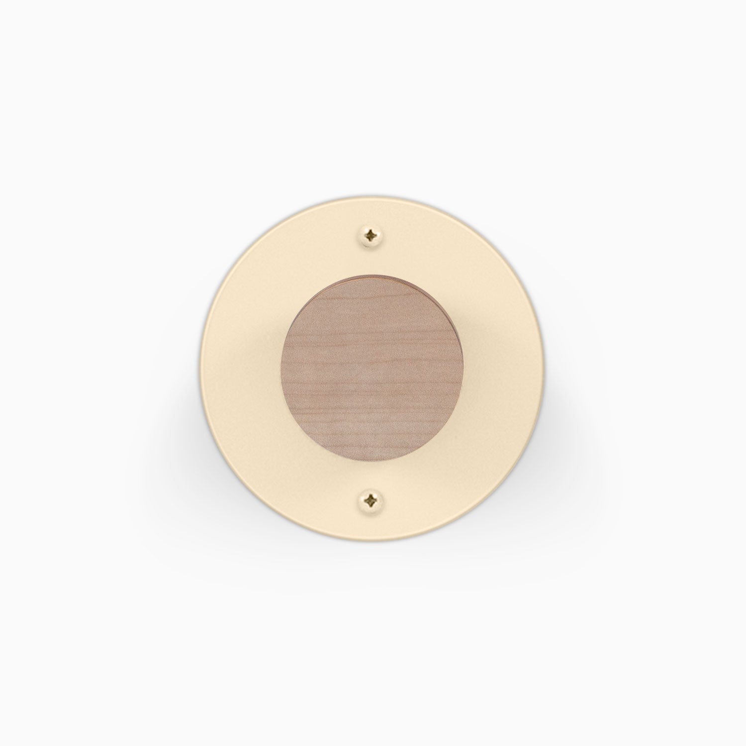 Runda Coat Rack 1 with a round cream finish wood center and two visible mounting screws for wall organization