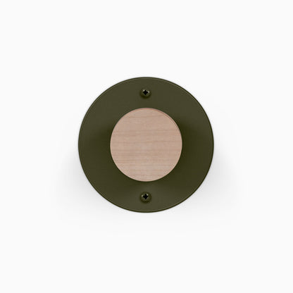 Runda Coat Rack 1 round wall hook with dark metal backplate and light wood center mounted on a white wall