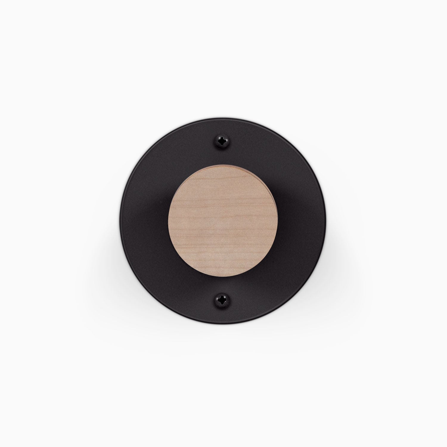 Runda Coat Rack 1 black circular wall mounted coat rack with a natural wood peg and two visible mounting screws