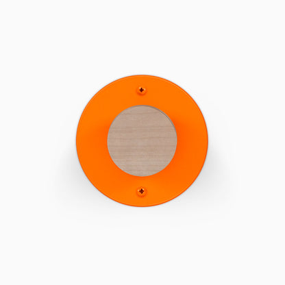 Runda Coat Rack 1 orange circular wall hook with a wood center and two visible mounting screws
