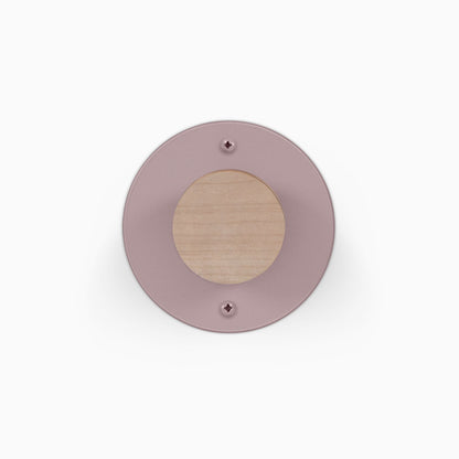 Runda Coat Rack 1 round coat rack with a blush pink circular backplate and natural wood center on a white background