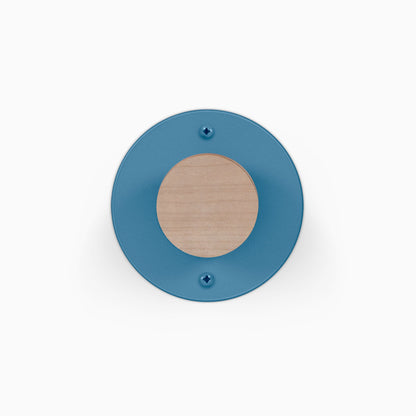 Runda Coat Rack 1 blue circular wall mounted coat rack with a natural wood center and two visible mounting screws