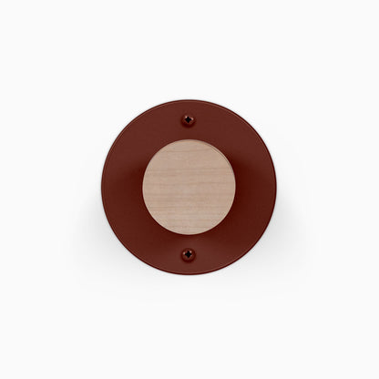 Runda Coat Rack 1 round wall hook with a wood peg and dark red circular metal mounting plate