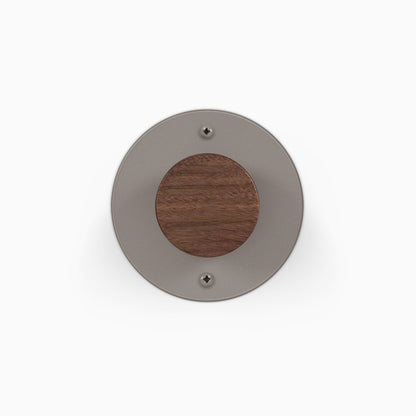 Runda Coat Rack 1 round gray metal wall hook with a wood center and visible mounting screws