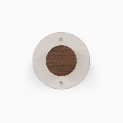 Runda Coat Rack 1 round wall hook in cream metal with a wood center for stylish entryway organization