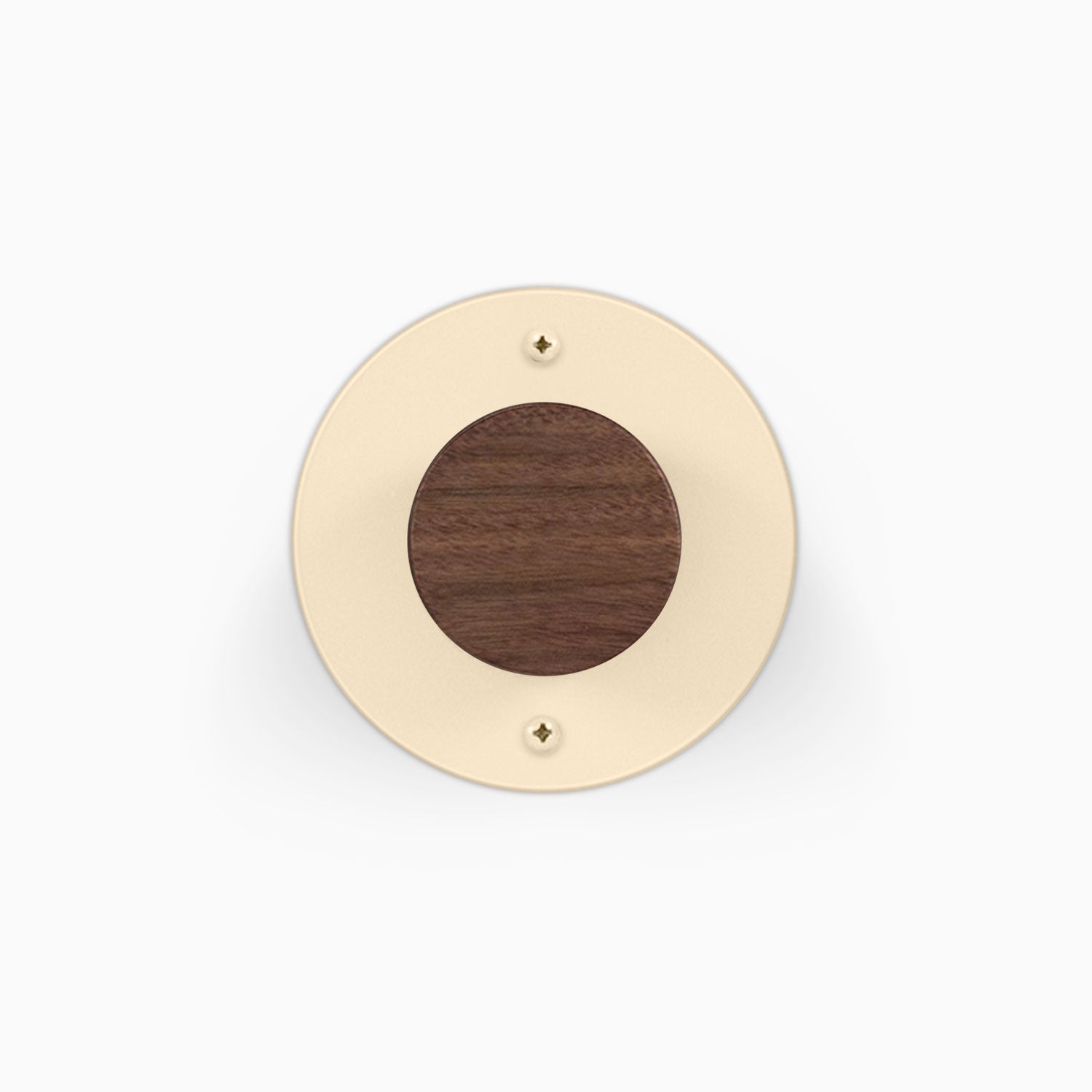 Runda Coat Rack 1 round cream wall mount with a dark wood center and visible mounting screws